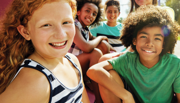 Group of kids sitting outside